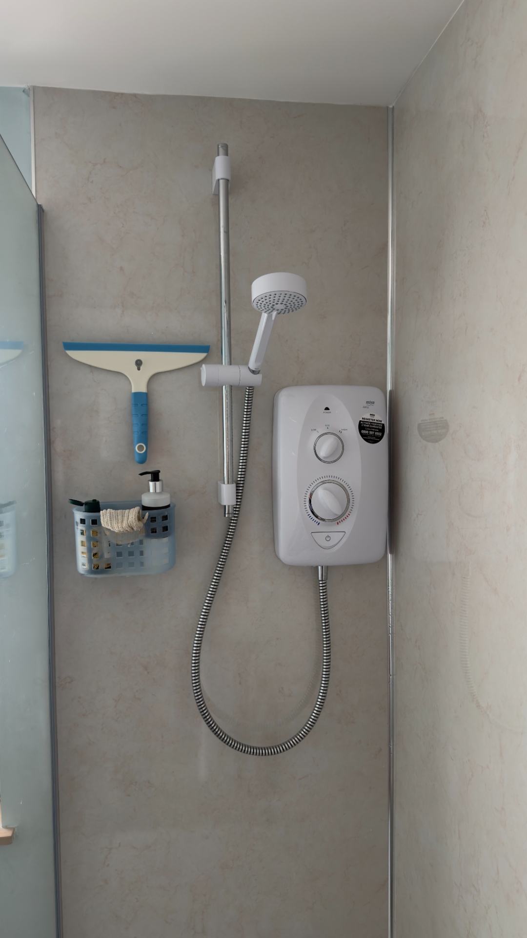 Mira electric shower installed in a walk-in shower cubicle