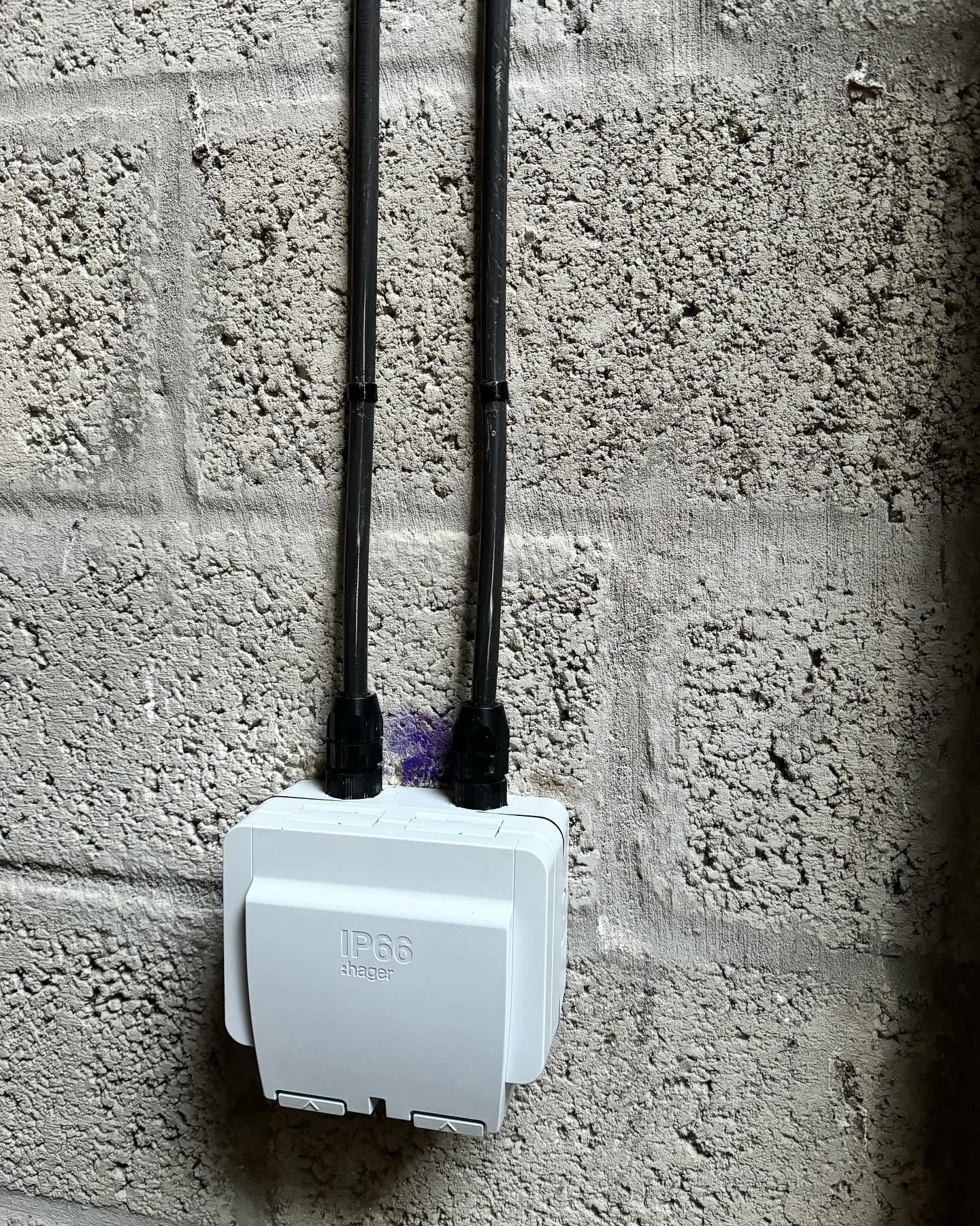 Two SWA cables clipped into a weatherproof Hager IP66 outdoor box with storm glands